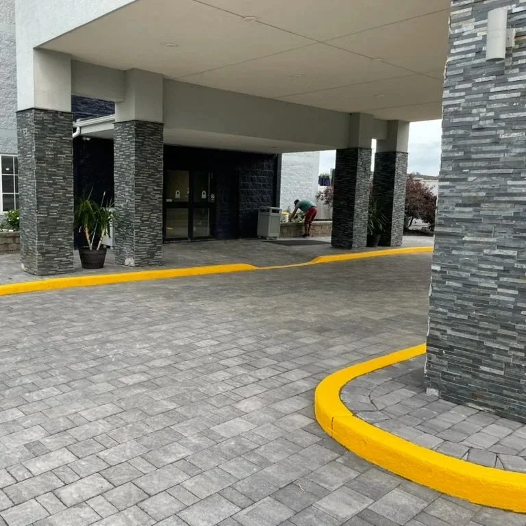 Hotel driveway replacement. Out with concrete, in with brand new pavers for the driveway and sidewalks.