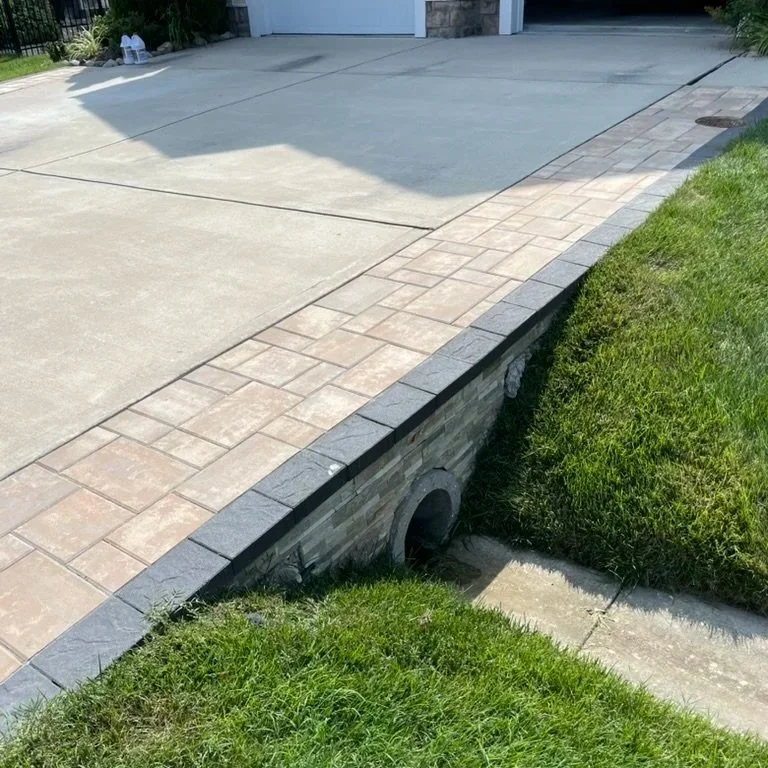Paver accent border on a driveway in Rehoboth Beach, Delaware.