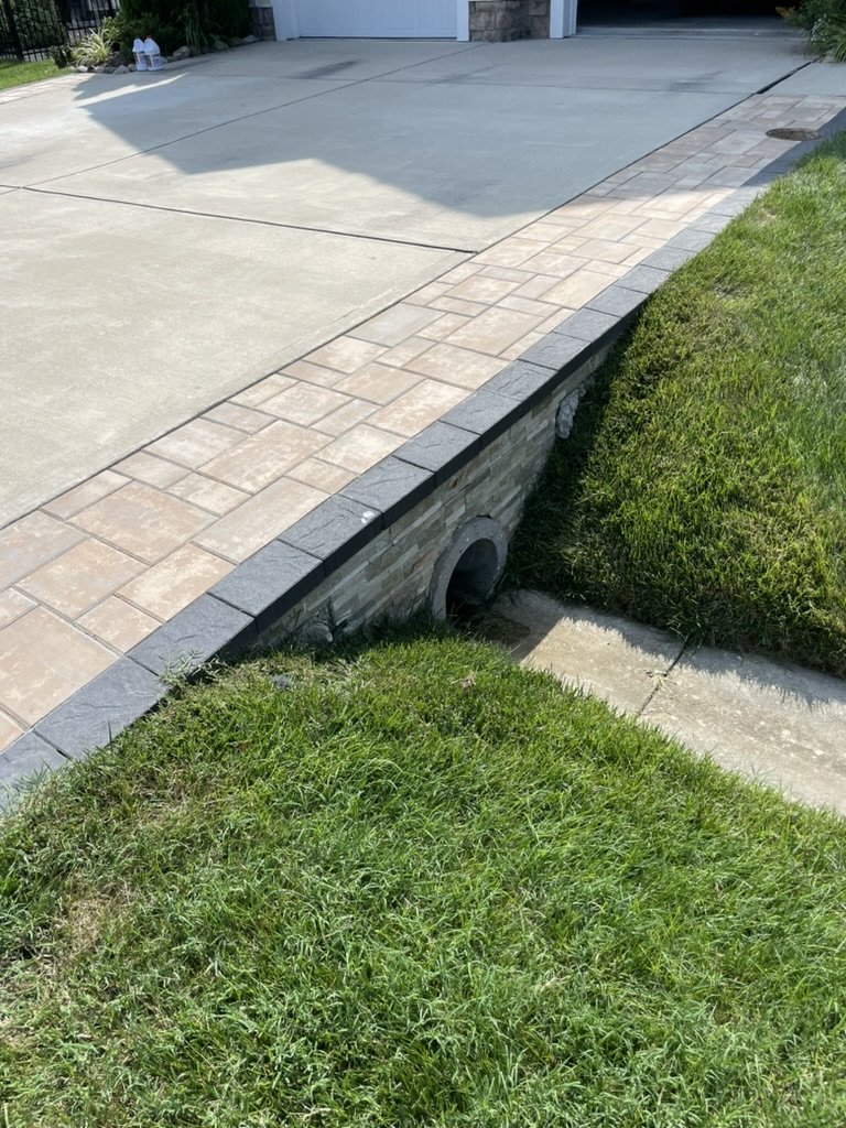 Paver accent border on a driveway in Rehoboth Beach, Delaware.