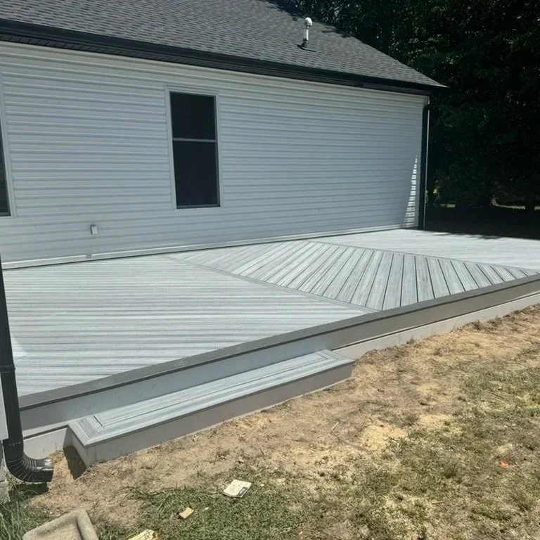 Ground-level deck with Trex decking and border in Millsboro, Delaware.