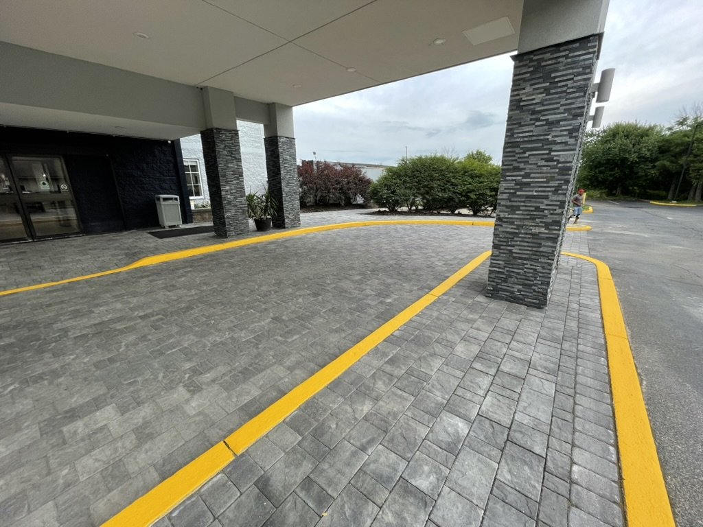 Hotel driveway replacement. Out with concrete, in with brand new pavers for the driveway and sidewalks.