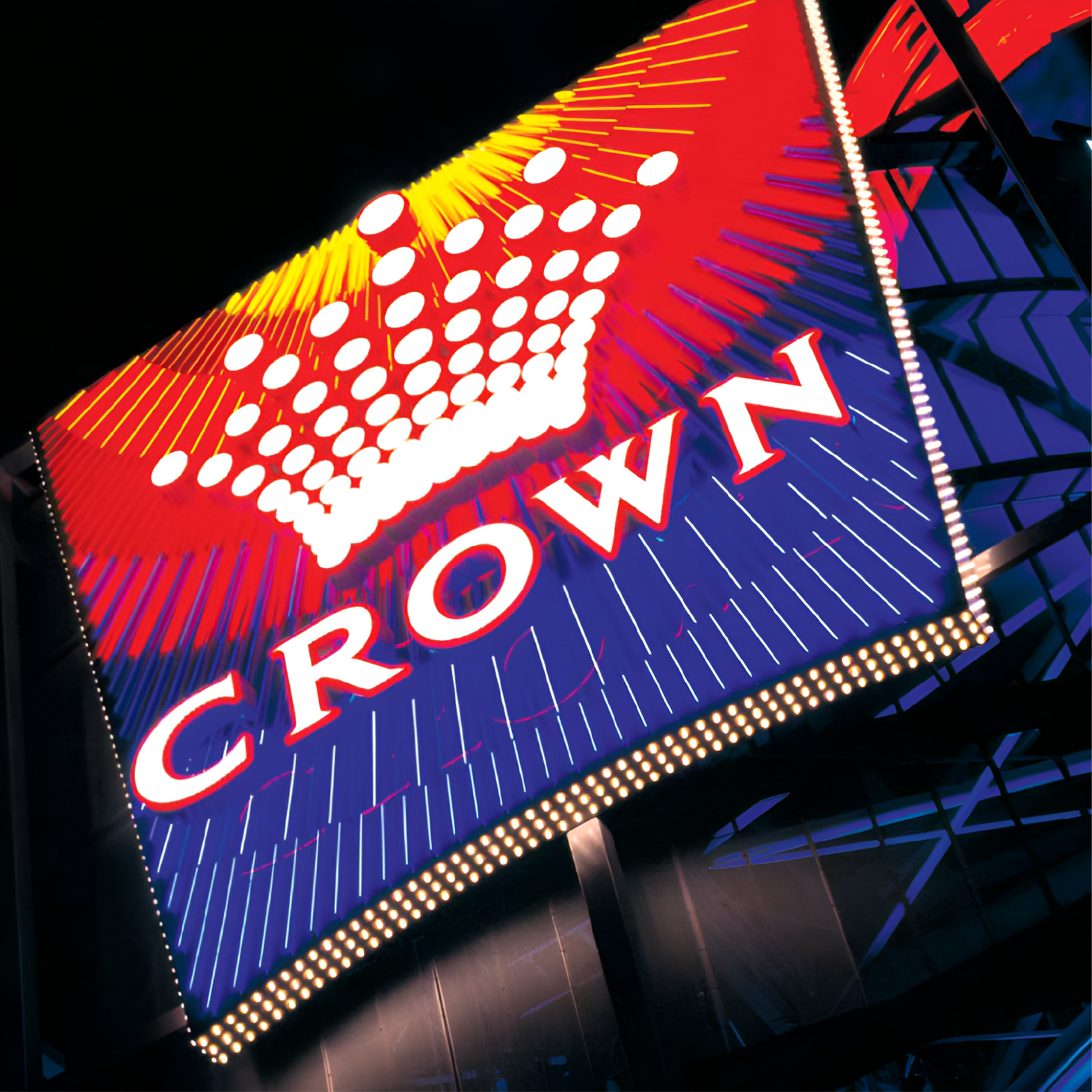 Bright neon sign displaying the word 'GROWN' with an abstract design of white dots and colorful lines, illuminated against a dark background.