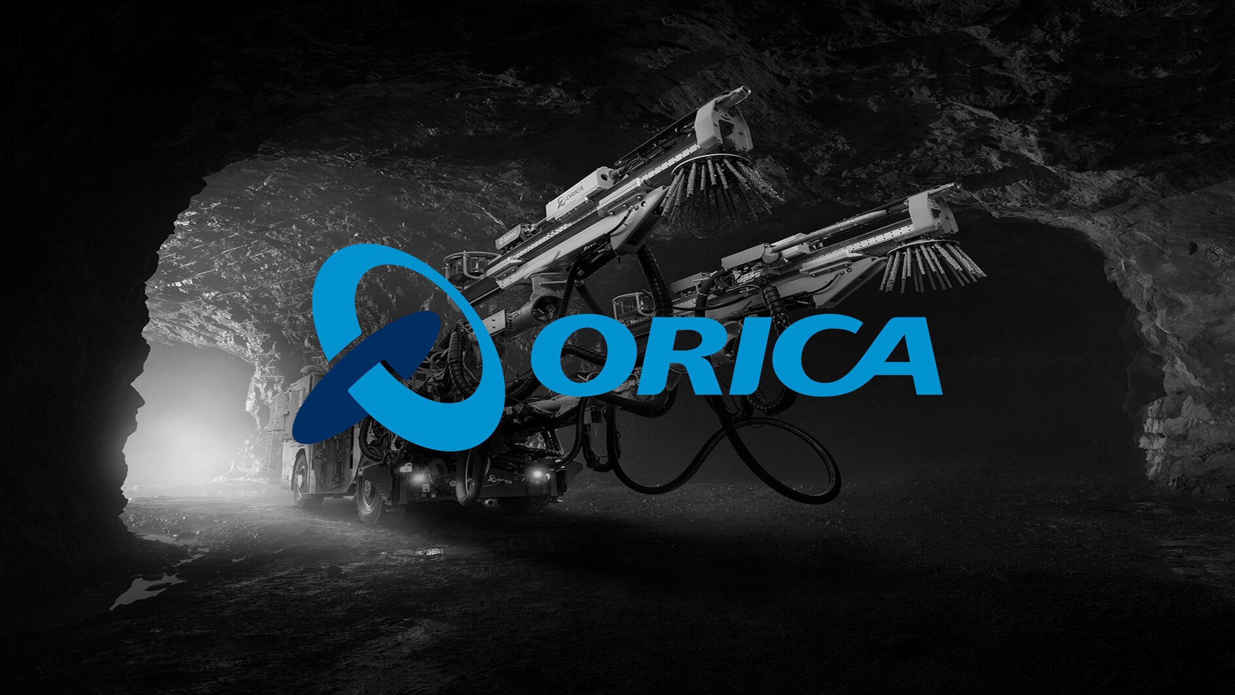 A large industrial machine working inside a dark, tunnel-like environment with the logo and name 'ORICA' overlaid in blue.