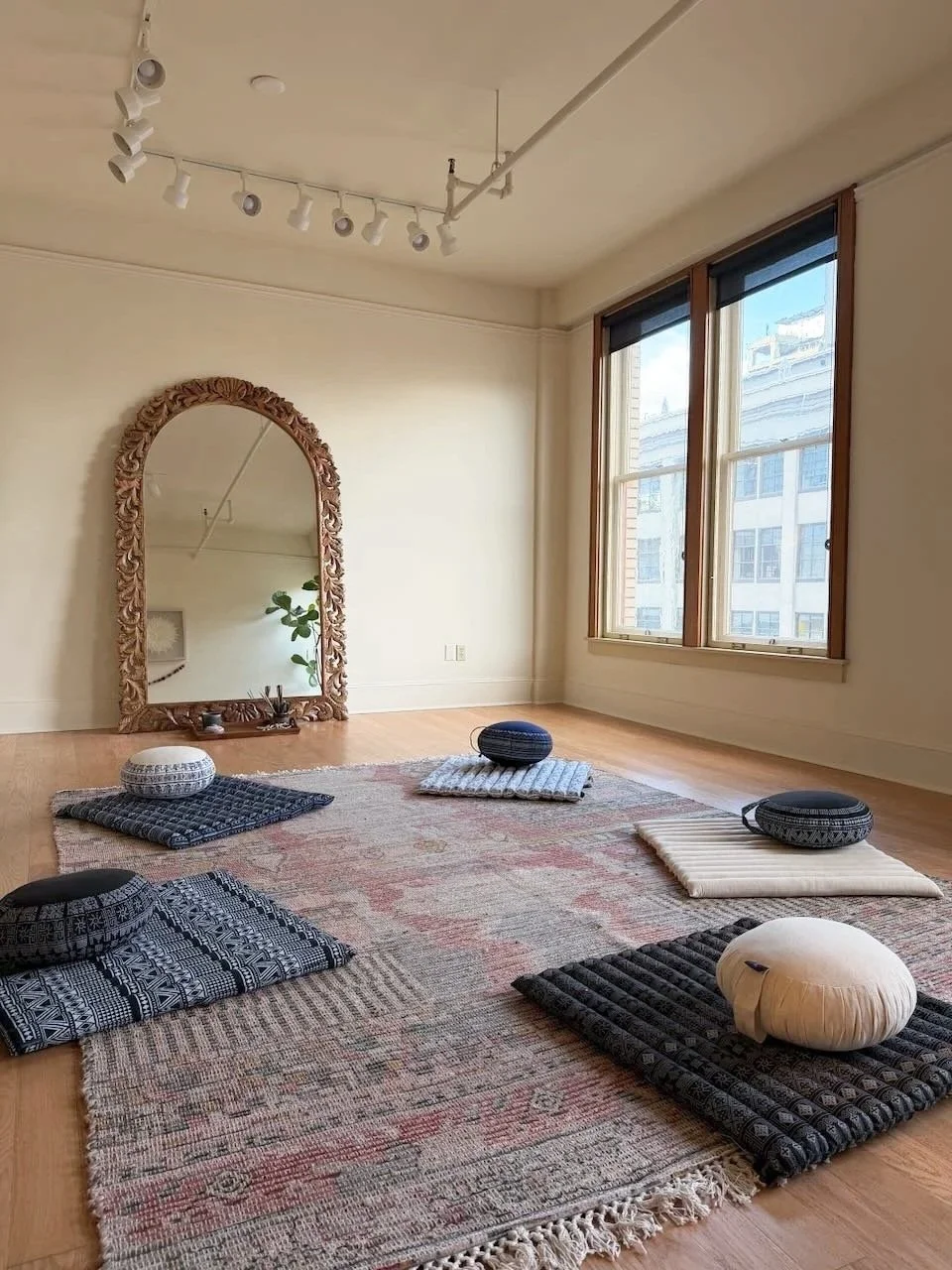 A medium sized room for group gathering, movement practice or bodywork or energy work.