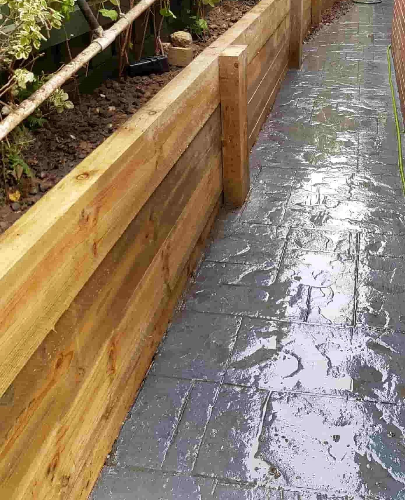 short-timber-sleeper-retaining-wall-with-timber-posts-for-garden-bed.jpg
