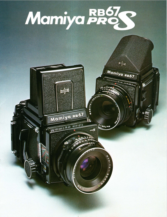 Two vintage Mamiya RB67 Pro S medium format cameras with lenses, one with a hood, placed on a light blue surface against a gradient background. The text "Mamiya RB67 PRO S" is displayed in the top left corner.