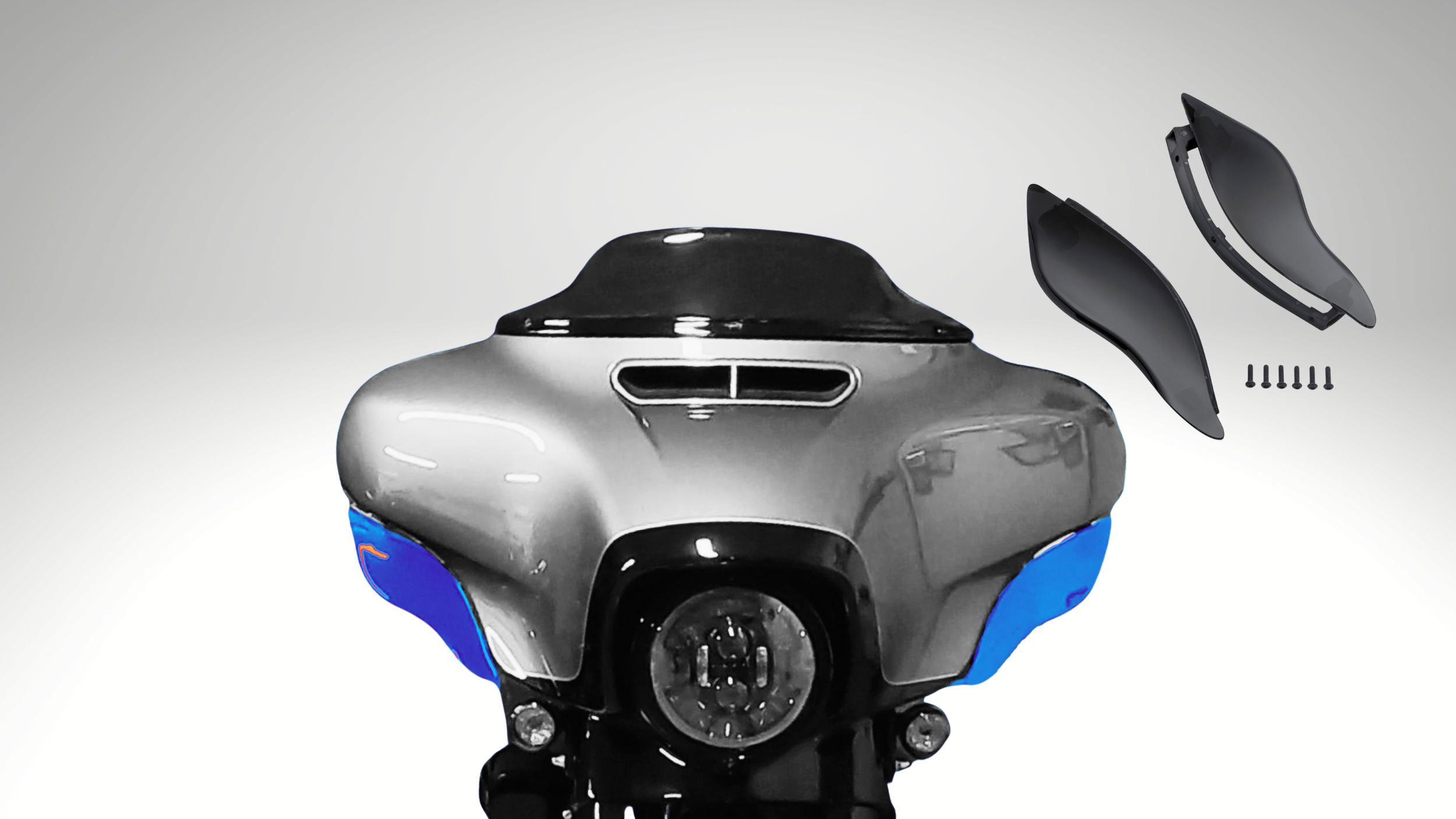 A motorcycle front fairing with detachable wind-shields, screws, and mounting hardware, viewed from the front.