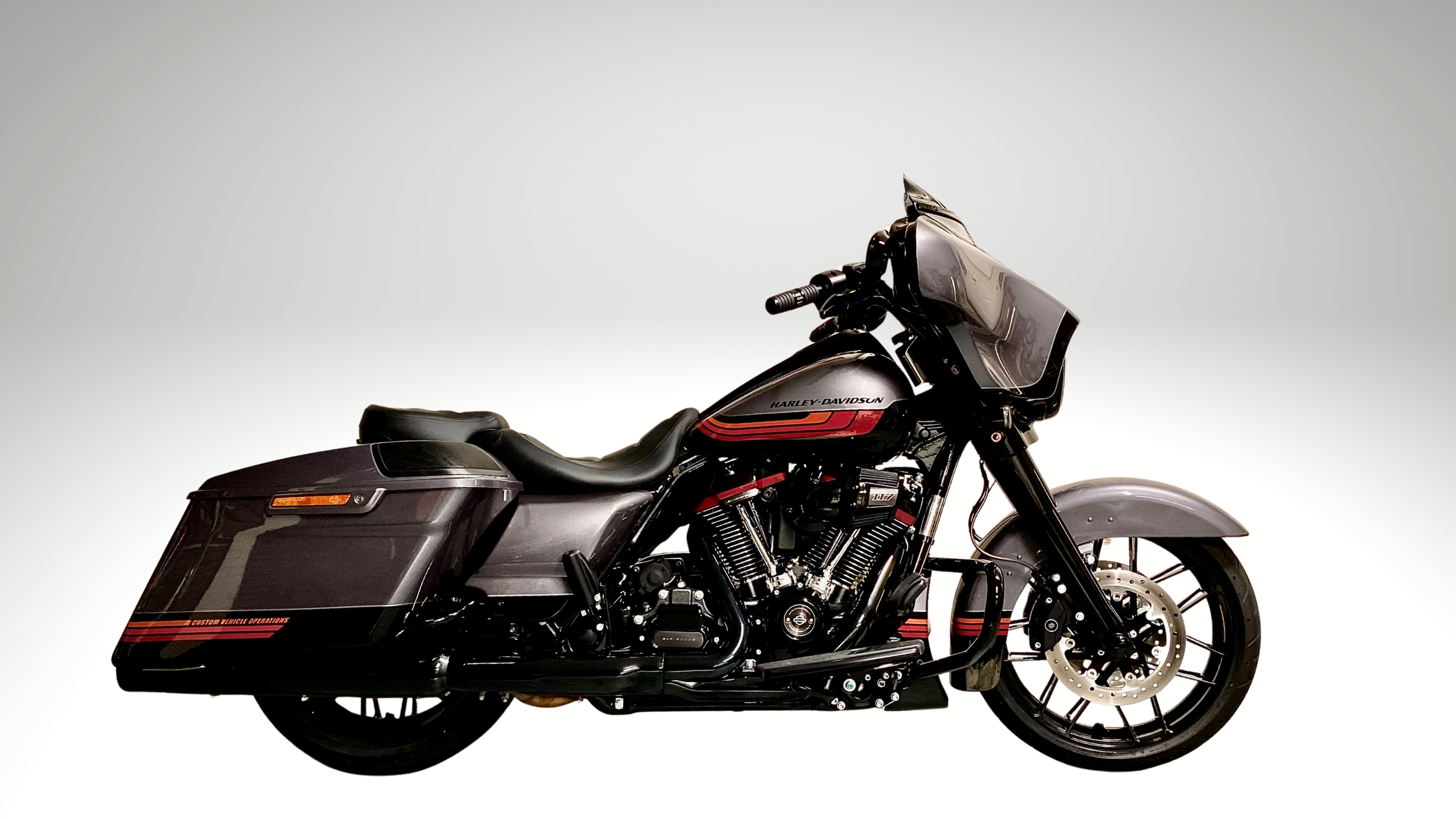 A black and grey Harley-Davidson CVO touring motorcycle with red accents, displayed against a plain white background.