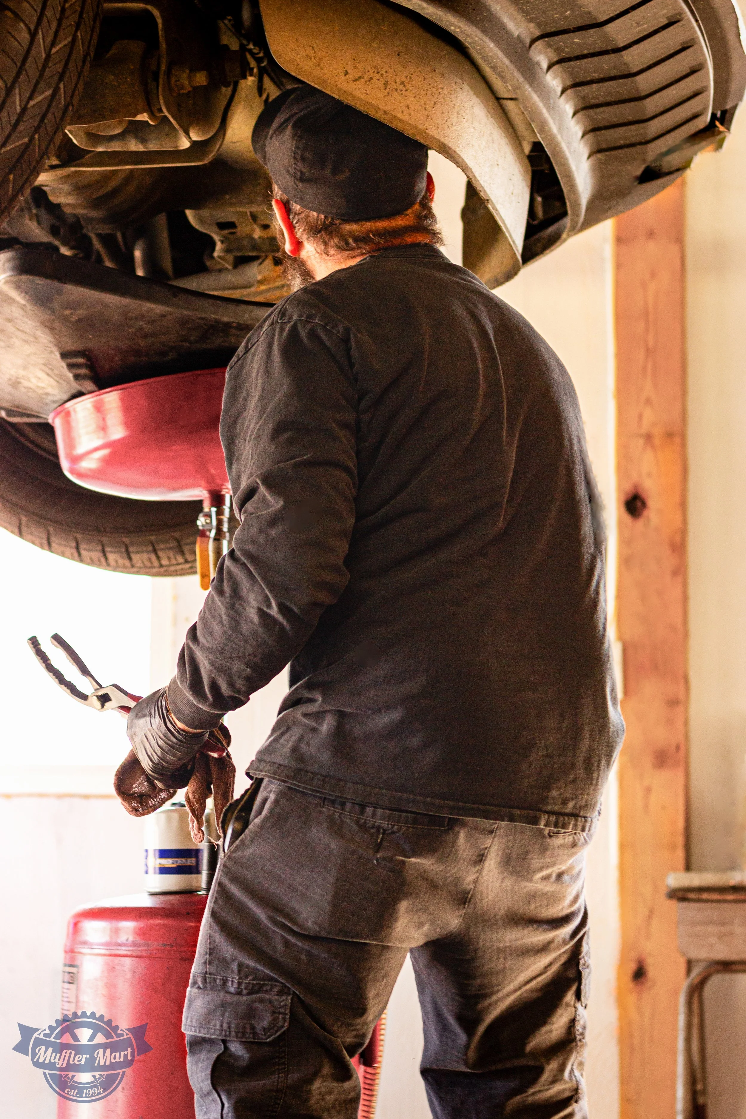 John Morgan - Muffler Mart-BackMechanic1.jpg