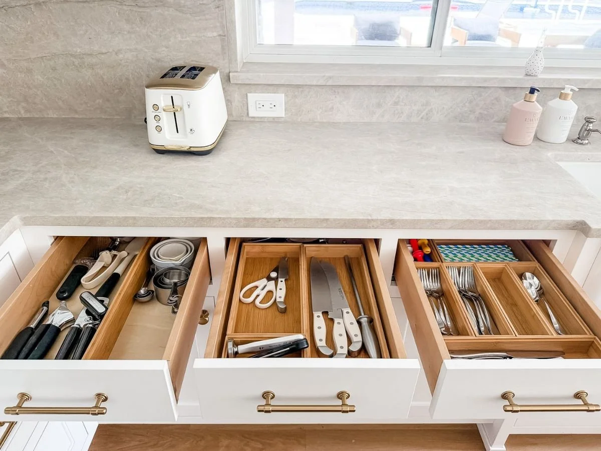 Organized kitchen drawers show the best way to unpack after moving with practical zones for daily essentials.