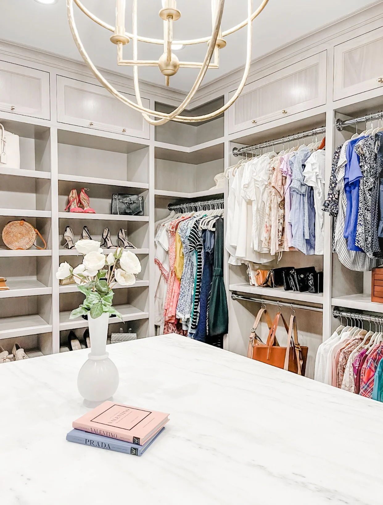 Neatly displayed clothes and shoes maintained by a seasonal home reset service.