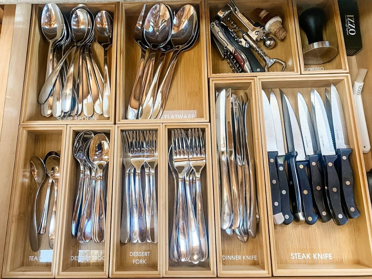 Declutter before moving by sorting duplicate kitchen utensils and deciding what to get rid of when moving.