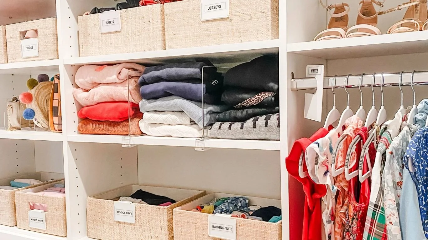 Labeled storage bins and closet dividers managed by a quarterly home maintenance membership.