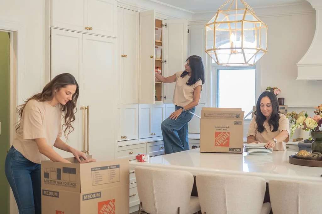 Everyday Order organizers working together to organize a home