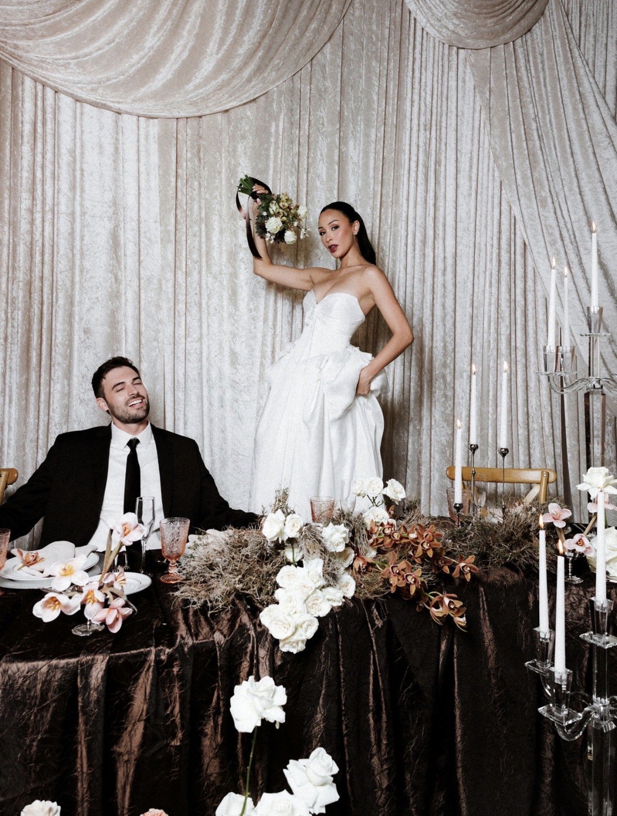 BRIDE AND GROOM AT THEIR HEAD TABLE PARK CITY VOGUE EDITORIAL SHOOT