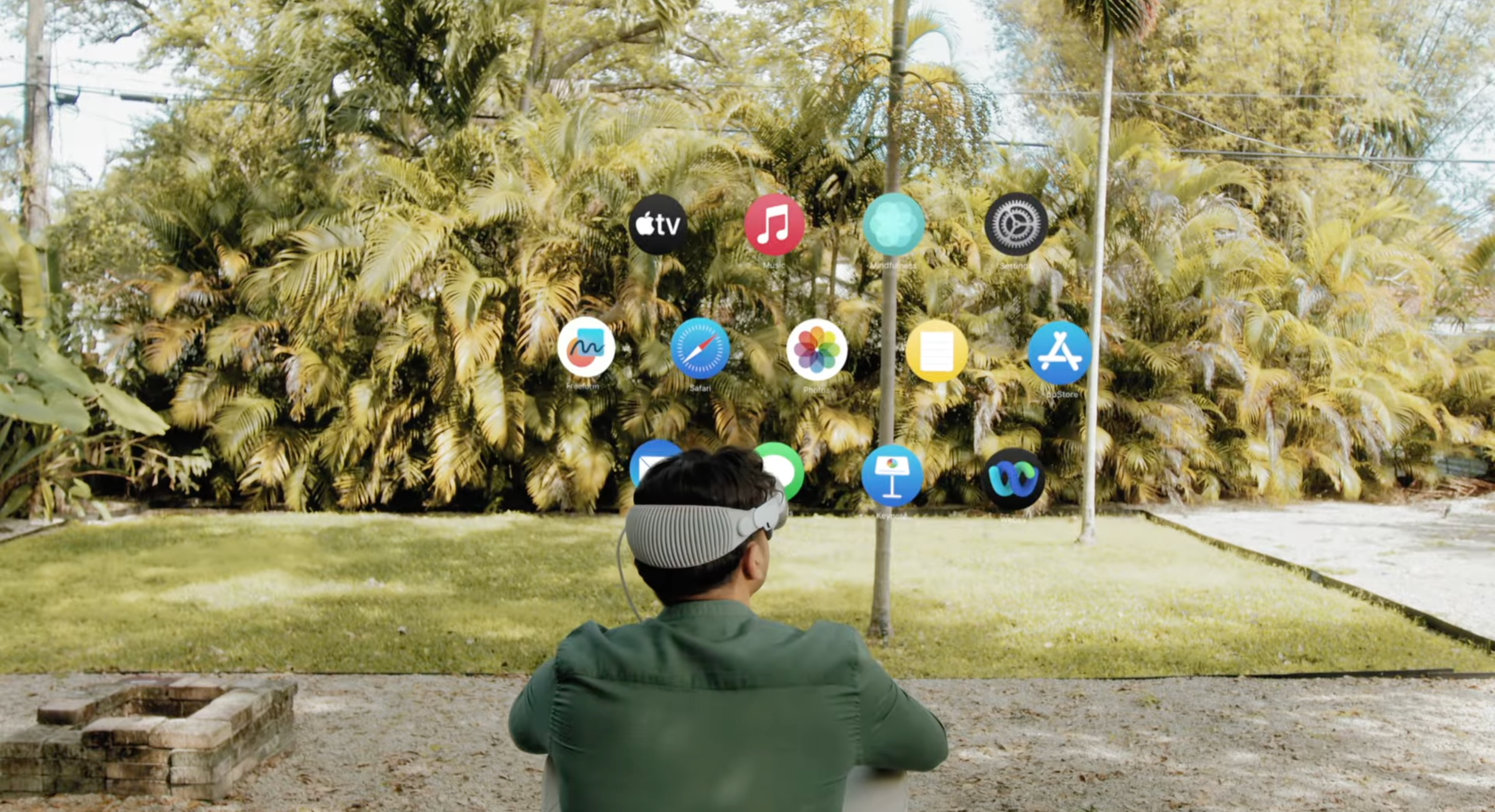 3D spatial video directed by ST Davis for Cisco Webex on Apple Vision Pro — talent wearing headset outdoors with floating app interface elements against natural greenery