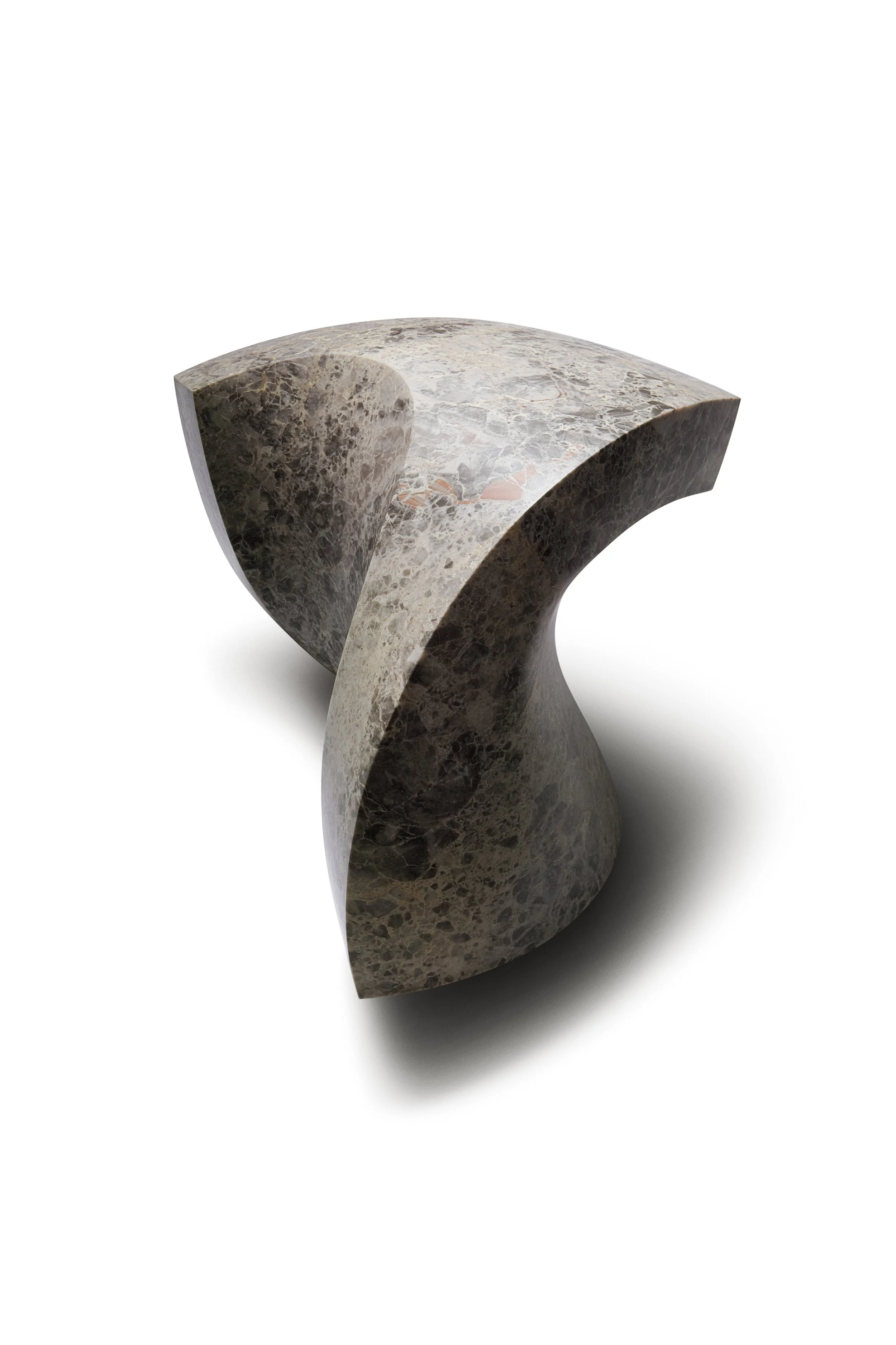 A modern, abstract sculpture piece made of marble with a unique curved, sculptural design.