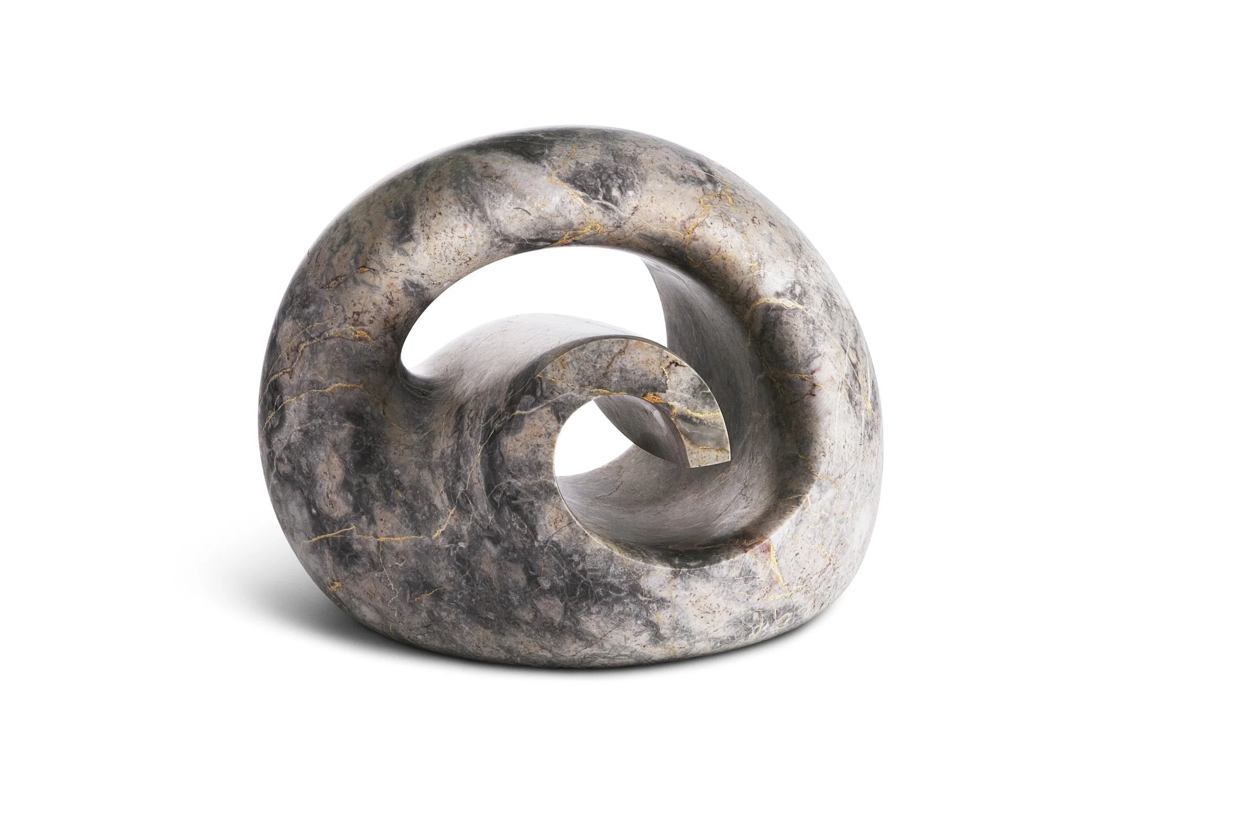 A smooth, polished marble sculpture resembling a spiral or swirl shape with natural gray, white, and gold veining, set against a white background.