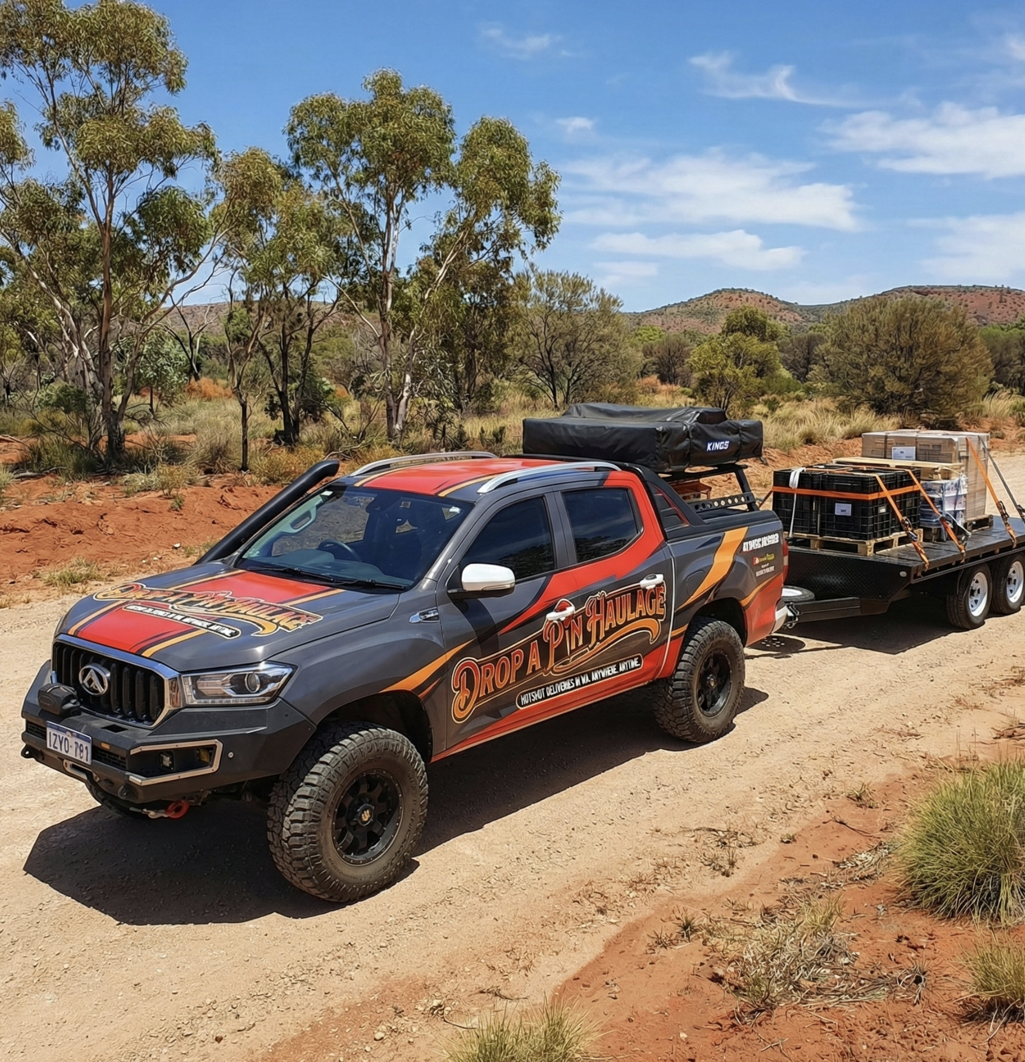 A black and red SUV with the words "Drop A Pin Haulage" on the side, pulling a flatbed trailer loaded with pallets of supplies across a desert landscape with trees and hills in the background.