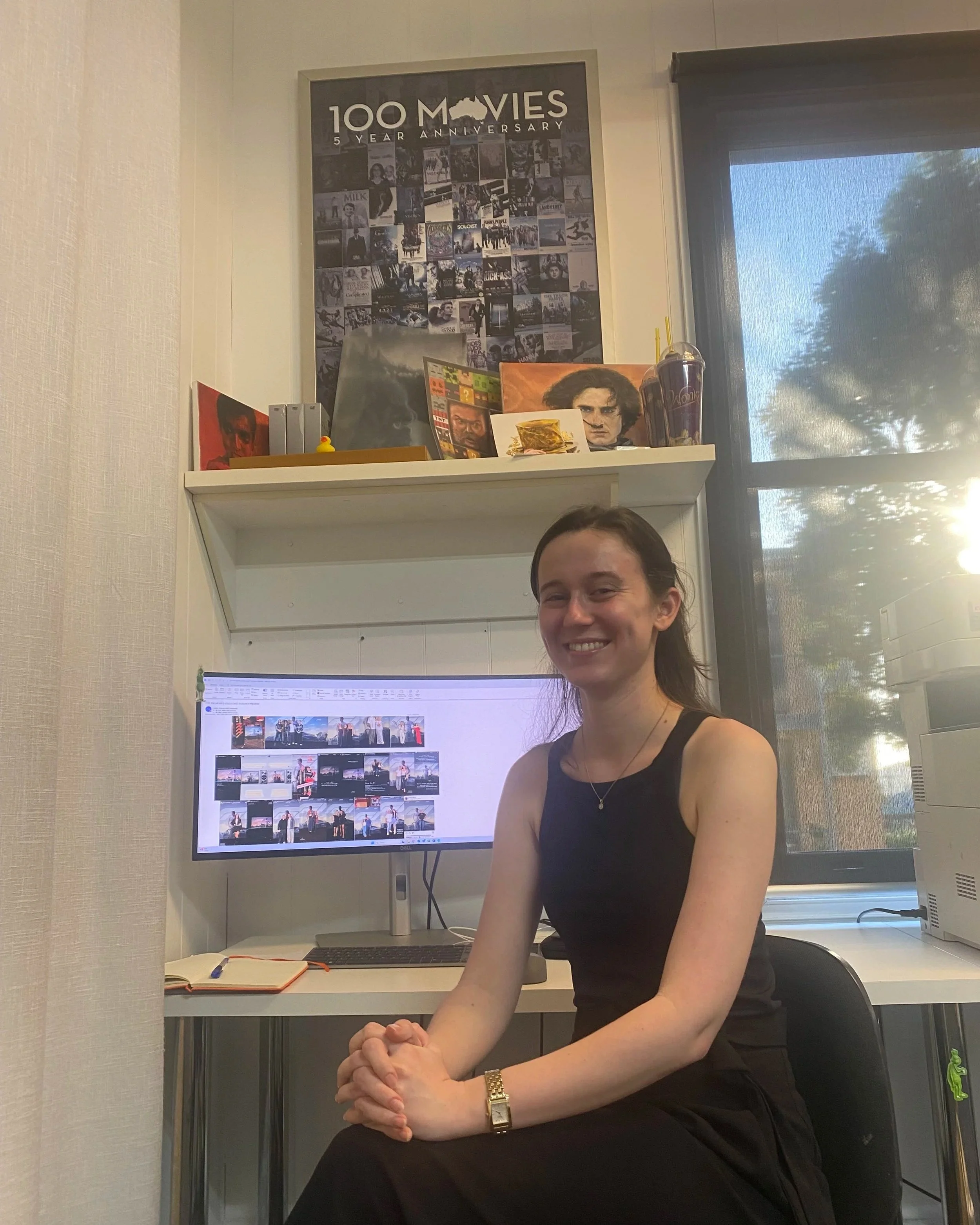 Abbie Sykes, hard at work in the Universal Pictures Brisbane office, organising publicity event reports for head-office.