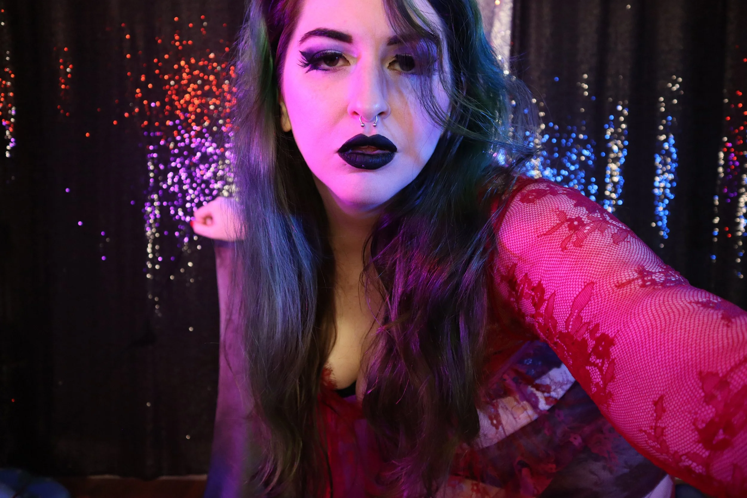 Supreme hypnodomme goddess joules in dark makeup, black lipstick, and red and black lingerie