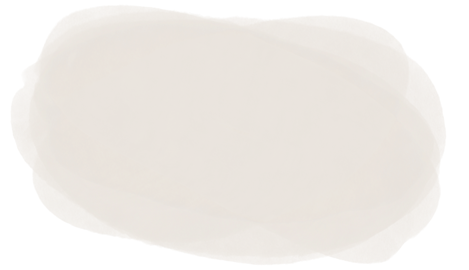 A white cloud-shaped speech bubble with no text inside, with a blurred background.