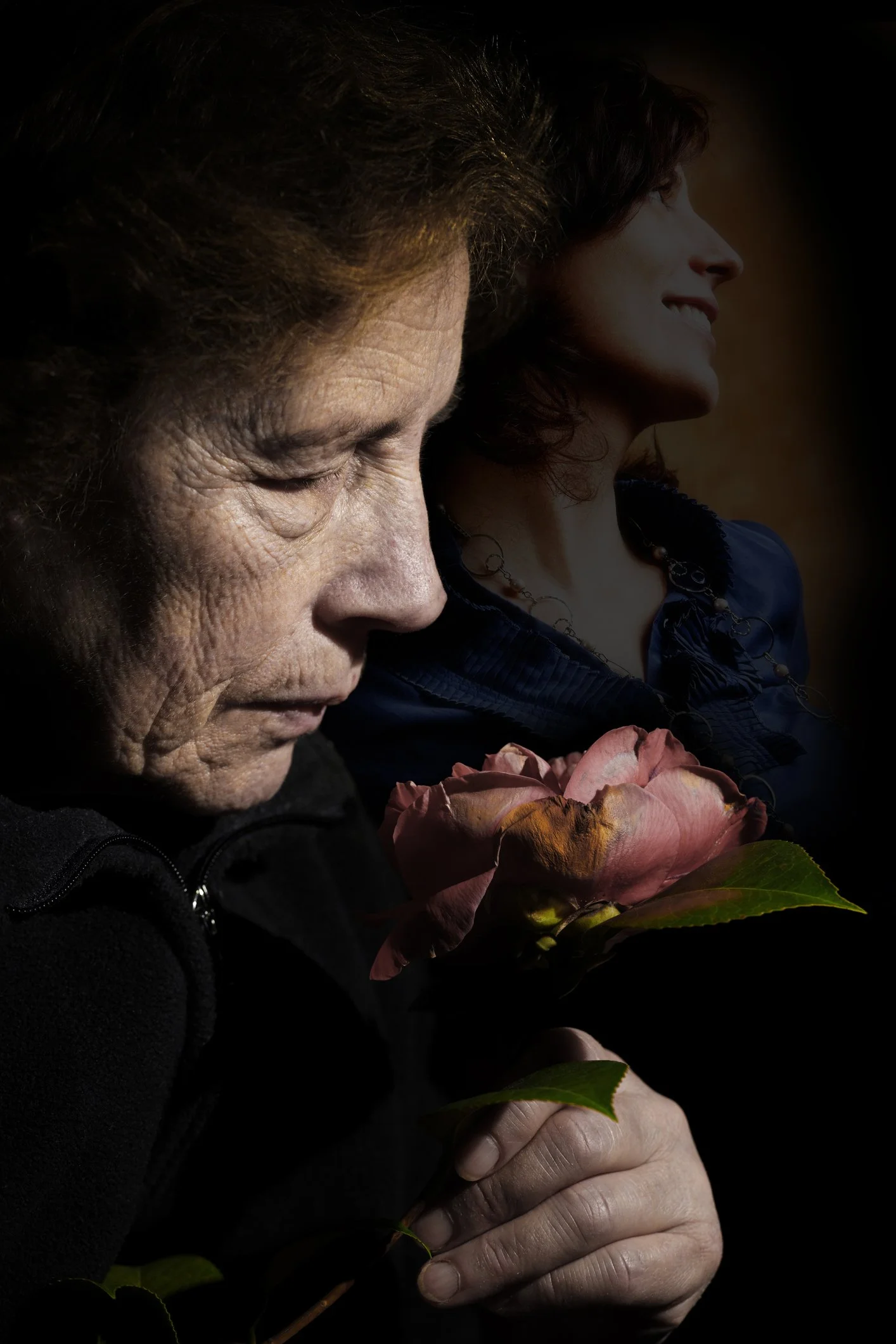 old woman smelling a rose and feeling nostalgia