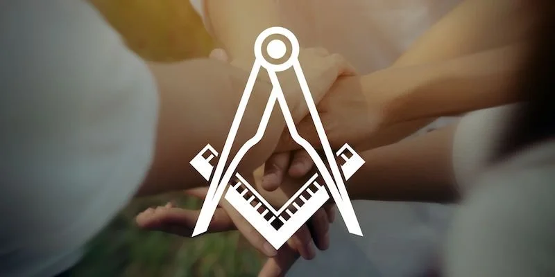 Two hands clasped together with a digital compass and ruler overlay