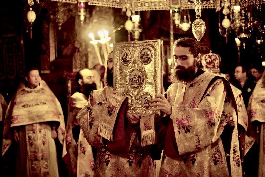 A deacon carrying the Gospel during the Little Entrance of the Orthodox Divine Liturgy
