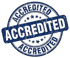 A blue stamp-like badge with the word 'ACCREDITED' written across the center, surrounded by the word 'ACCREDITED' repeated in a circular pattern.