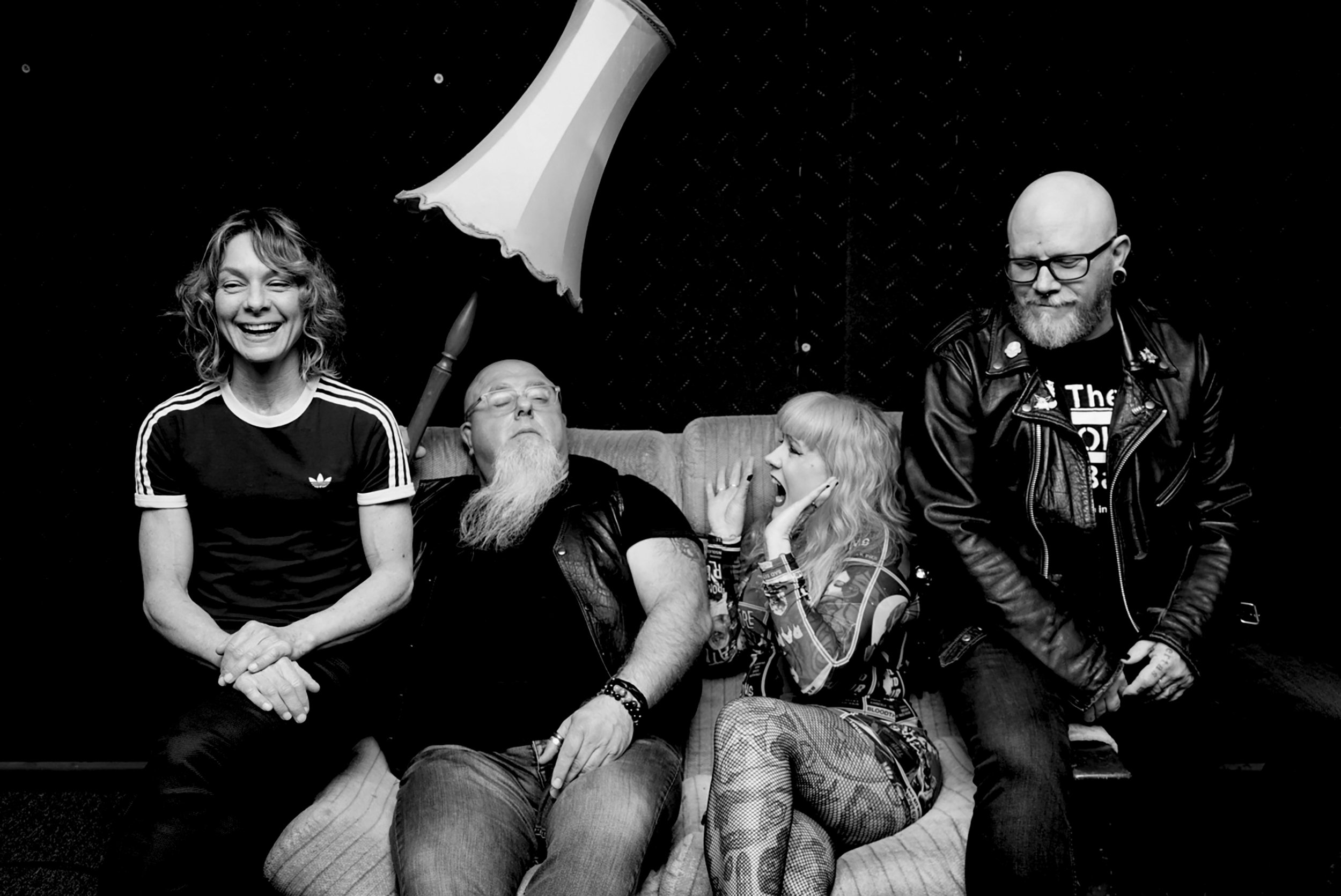 Pointless Daggers punk band sitting on couch being silly