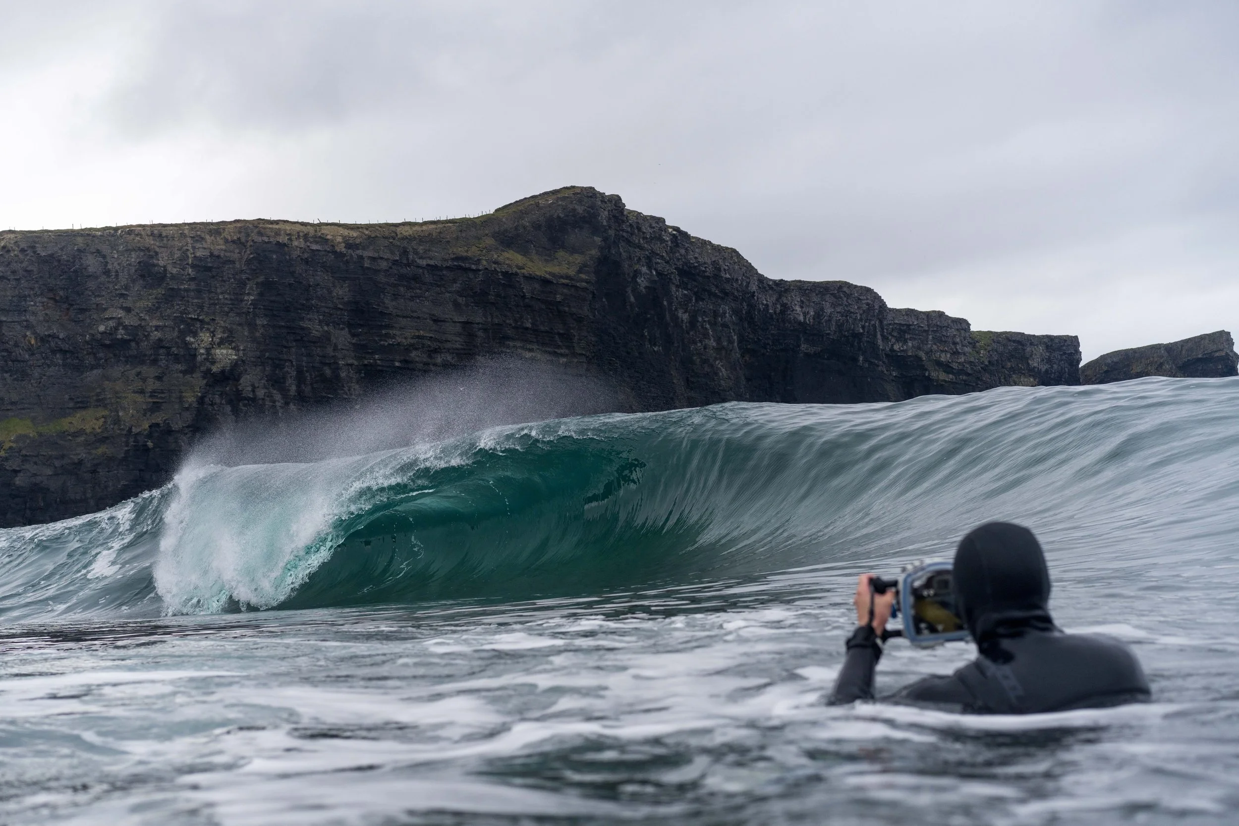 Walrus in-water photographing a wave. Photo by Tristan Keroullé