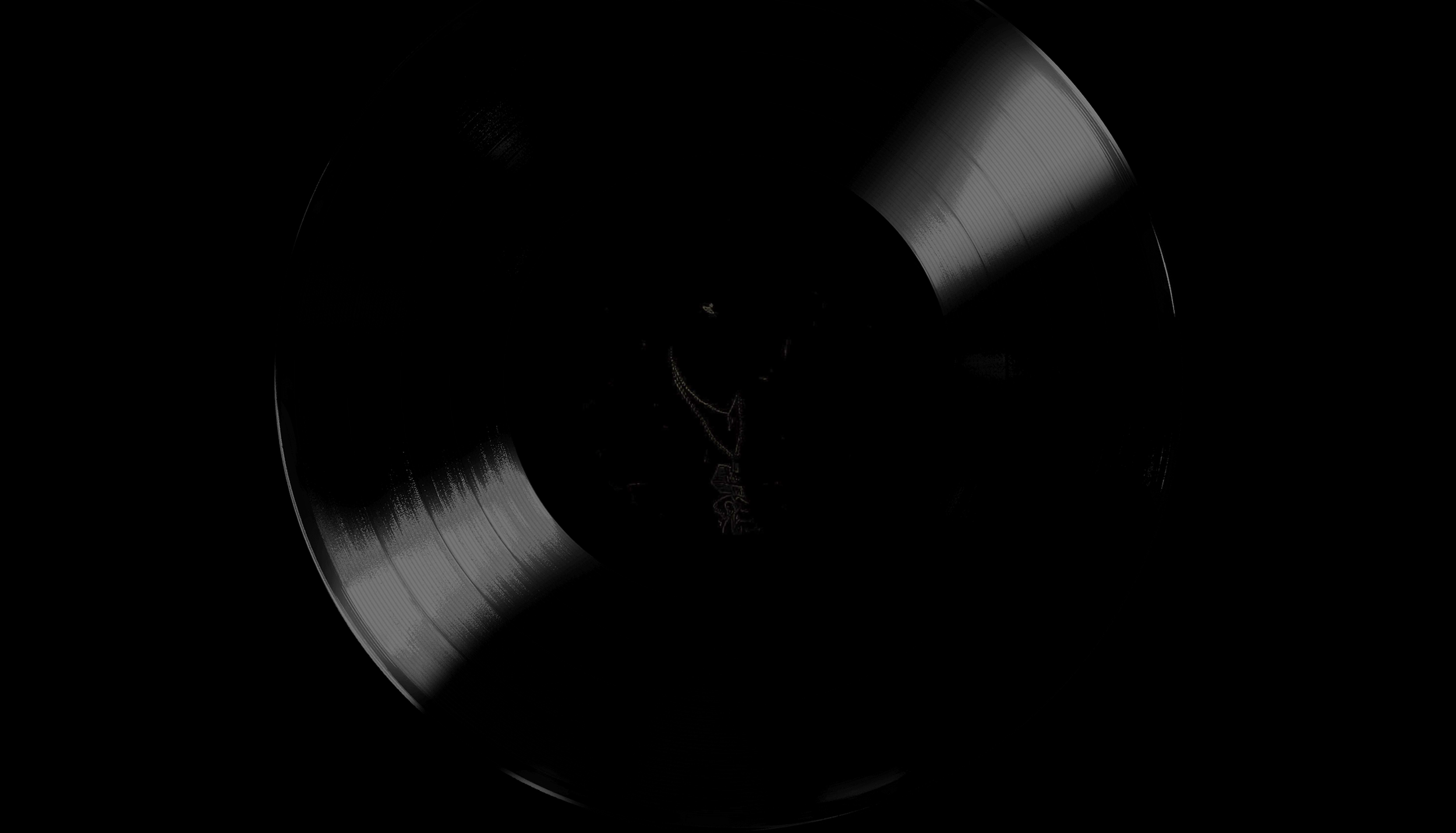 A black vinyl record with JayCxrtxr in the center, possibly hinting at an upcoming Album.