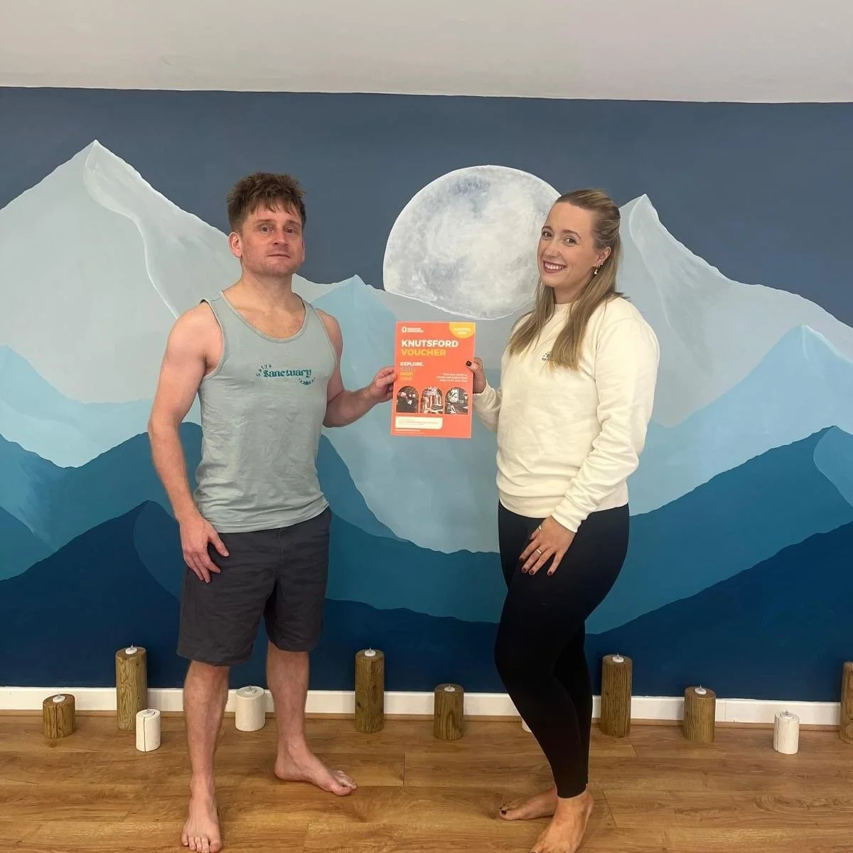 Yoga teacher Tim Heywood and Studio Director Charlotte Montgomery in the main studio at Satya Sanctuary where our Hot Yoga, Yoga, Mat Pilates, Barre, Post Natal, Children's and Group fitness classes take place 