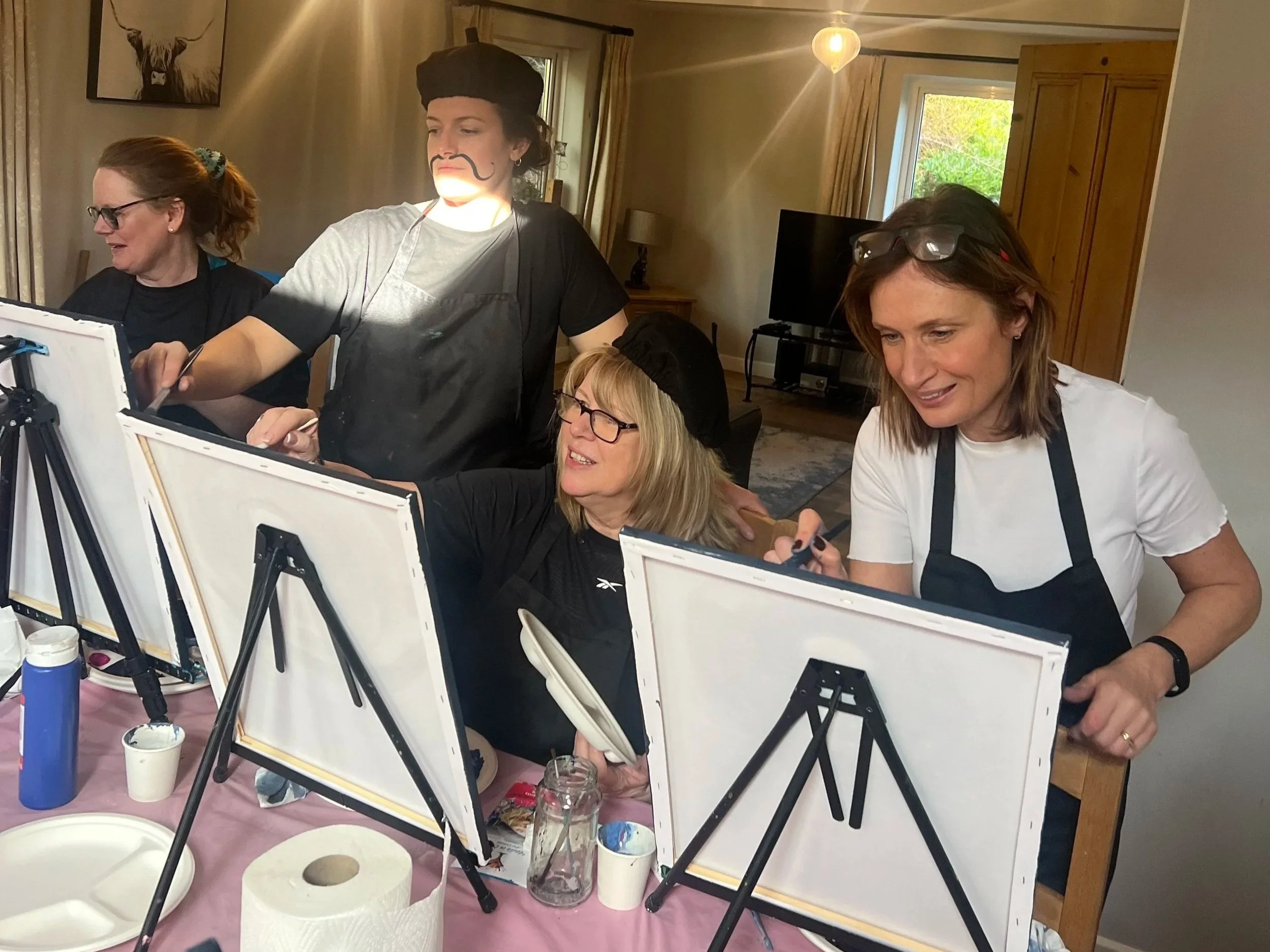 Women painting on a Satya Sanctuary retreat in the Peak District