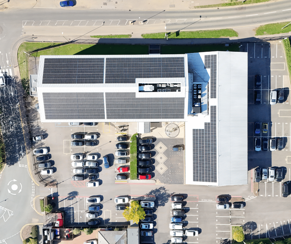 Aerial view of a commercial building with solar roof, showing typical drone imagery used in Ovrsite asset inspections.