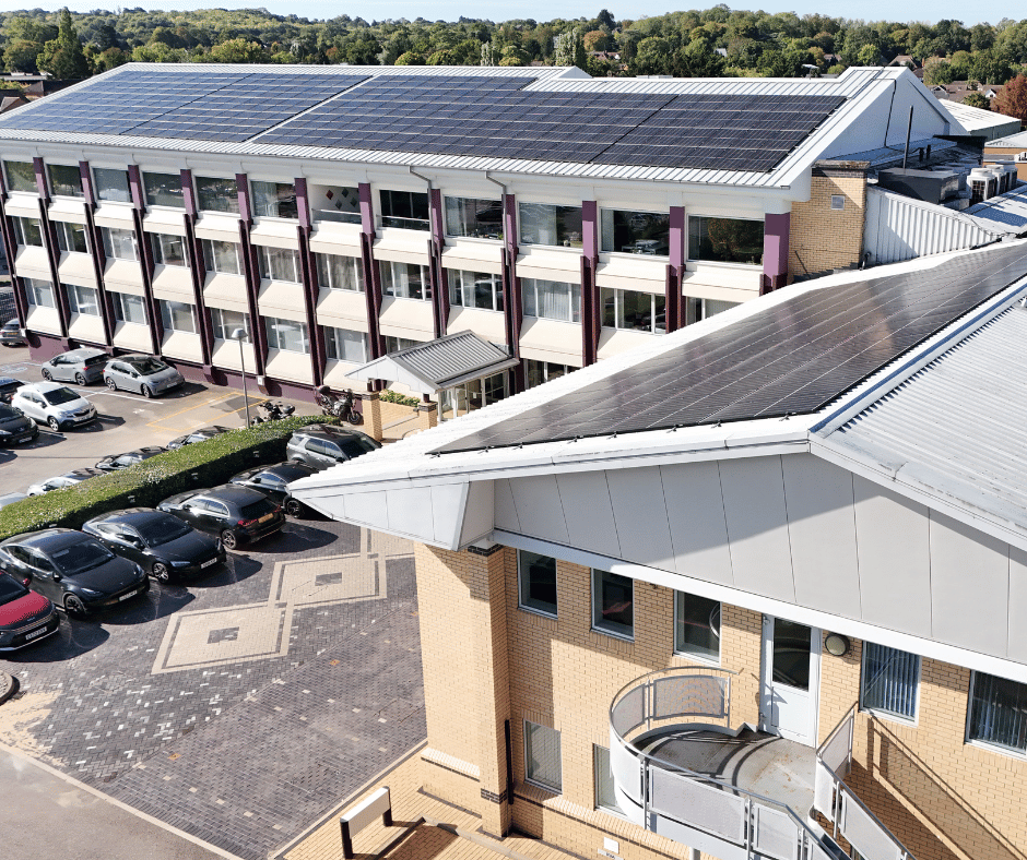 Multi-storey commercial building with solar panels, representing sites supported by Ovrsite roof asset management.