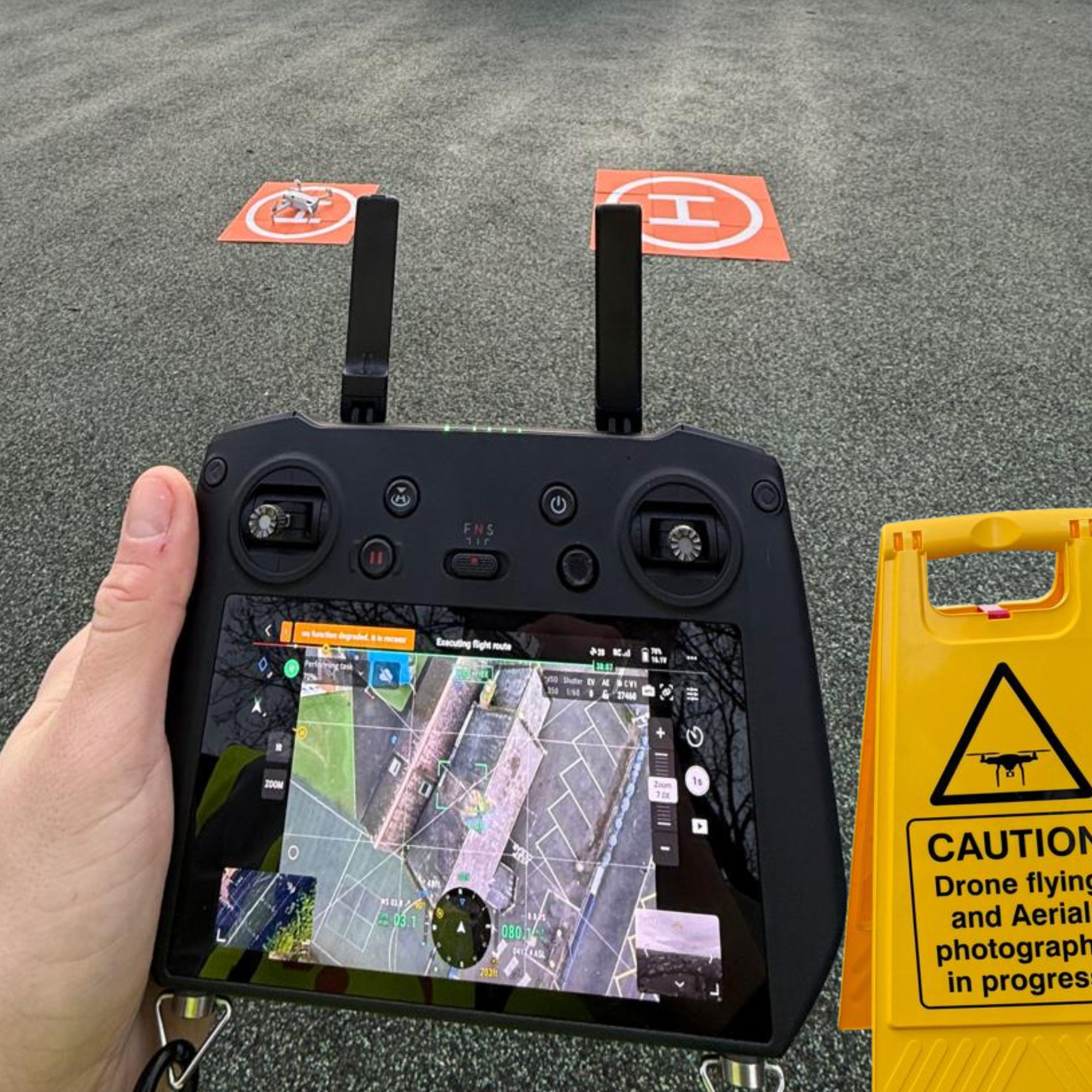 UAV capturing high-resolution visual and thermal data across a building envelope