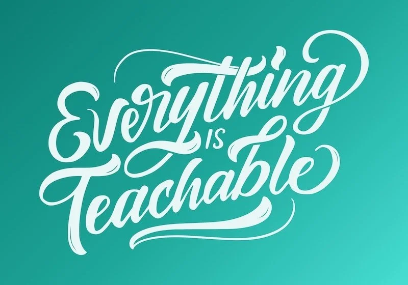 Inspirational quote stating 'Everything is teachable' in elegant white script on a teal background.