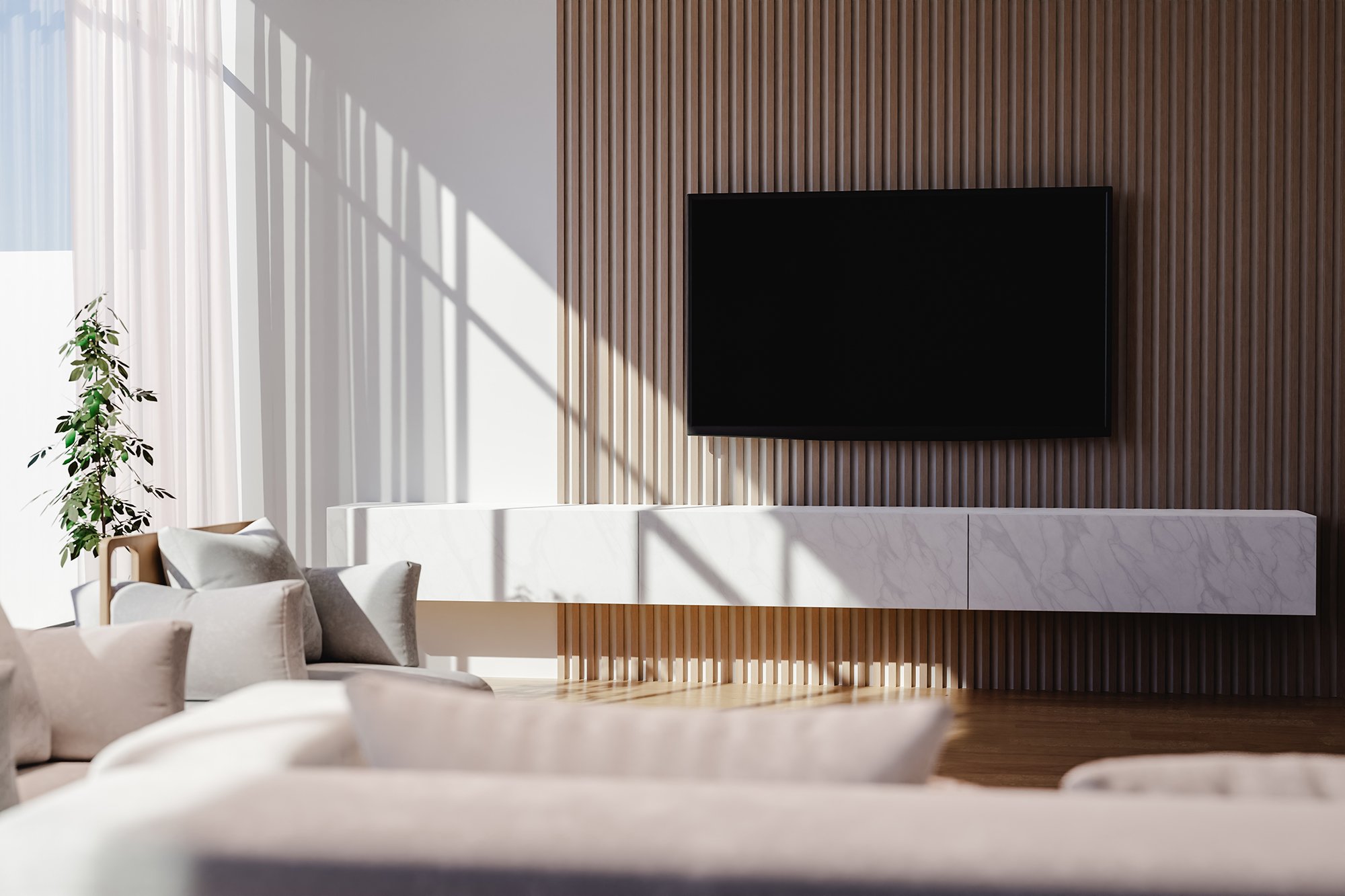 Modern living room with beige sofa, white cushions, a TV mounted on a wooden slat wall, and a white marble console, with sunlight and shadows through curtains and window.