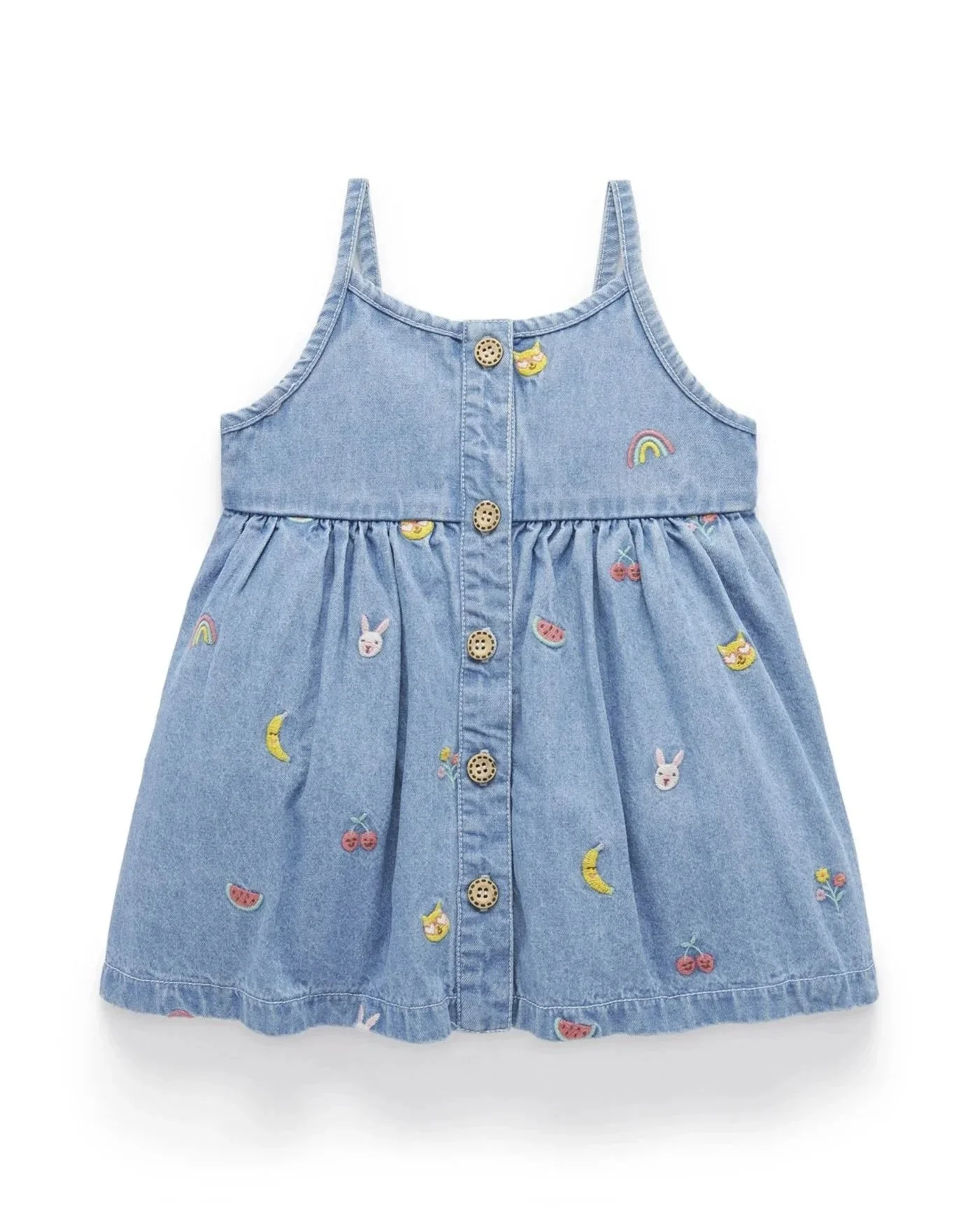 Light blue denim dress with embroidered colorful fruit, animal, and rainbow patches, featuring shoulder straps and button-down front.