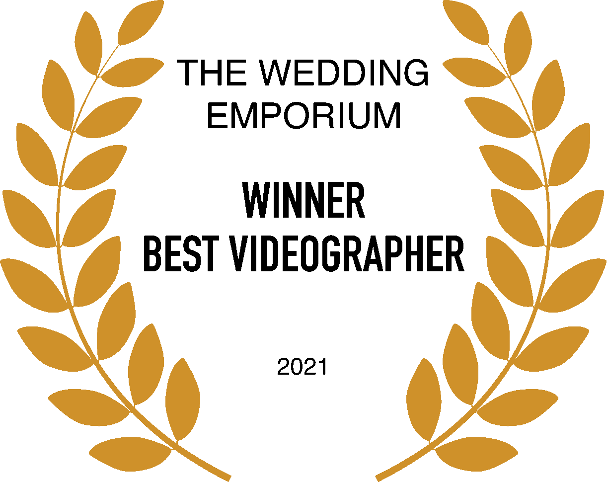 Golden laurel wreath surrounding the text 'Winner Best videographer 2021' in black. Above in text is The wedding emporium