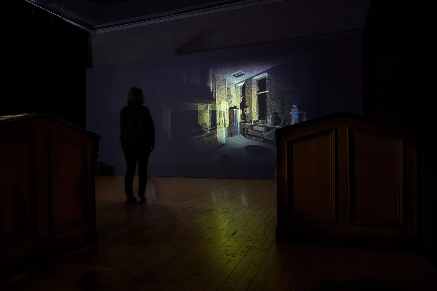 Woman looks at projected lidar imagery