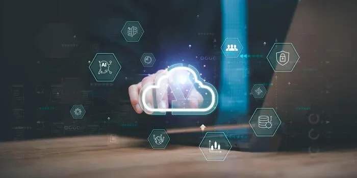 Person in a suit touching a digital cloud icon on a transparent screen with various cloud computing and data security icons around.