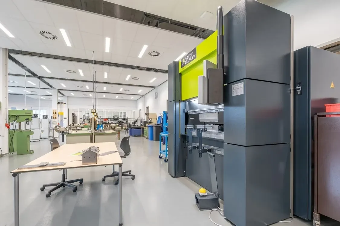 Modern sheet metal fabrication workshop with CNC press brake