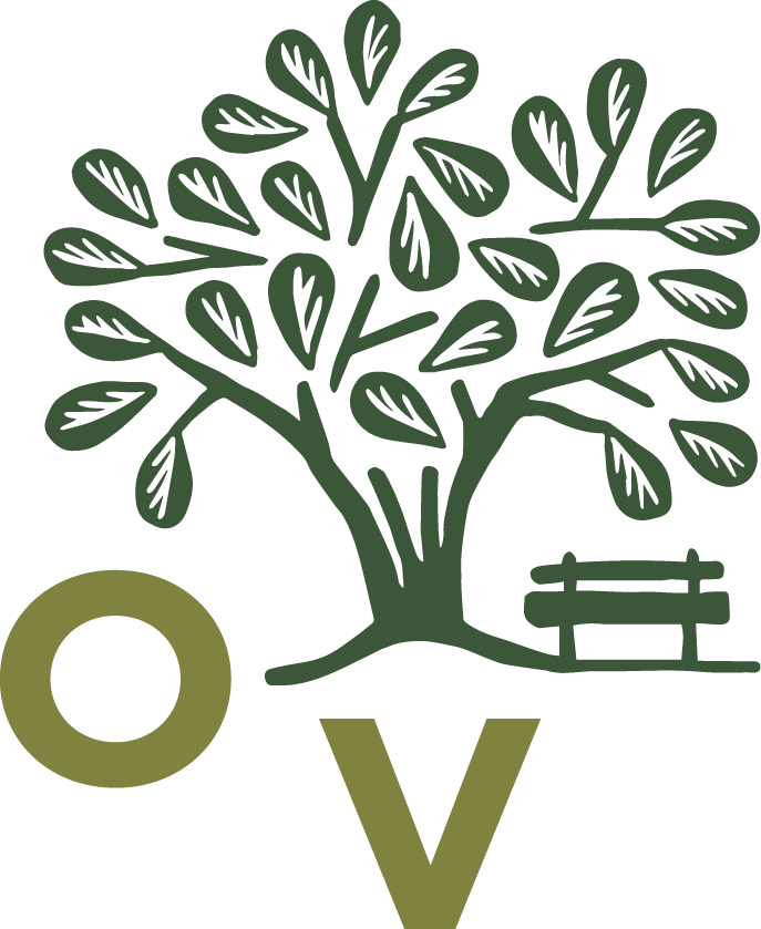 Illustration of a green tree with many leaves, a park bench, and the letters O and V in green.