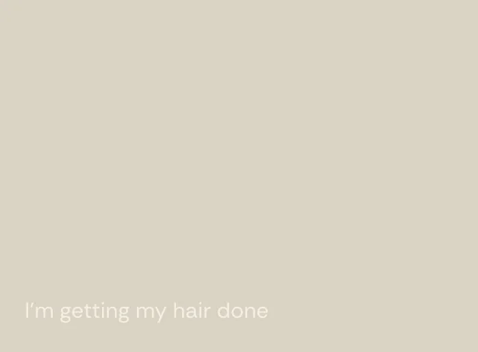 Text overlay saying "I'm getting my hair done" on a beige background.