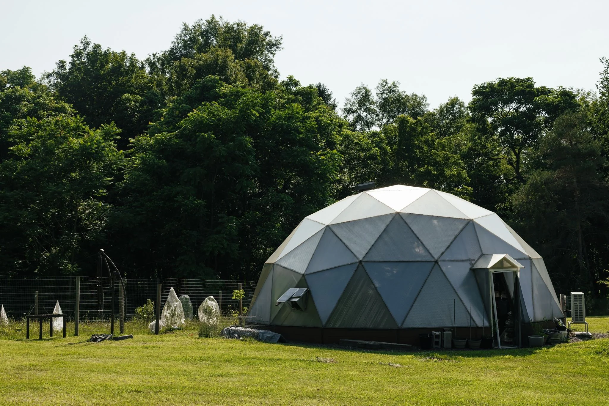Event dome among the trees at Little Logan's Farm