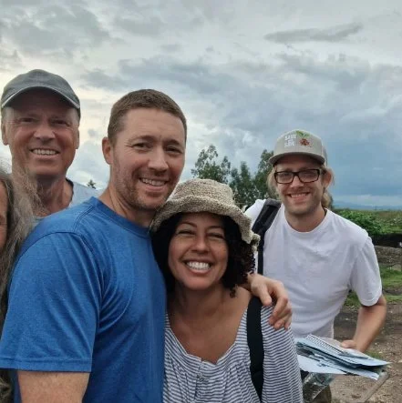 Frances, Eric and family smiling together on the farm
