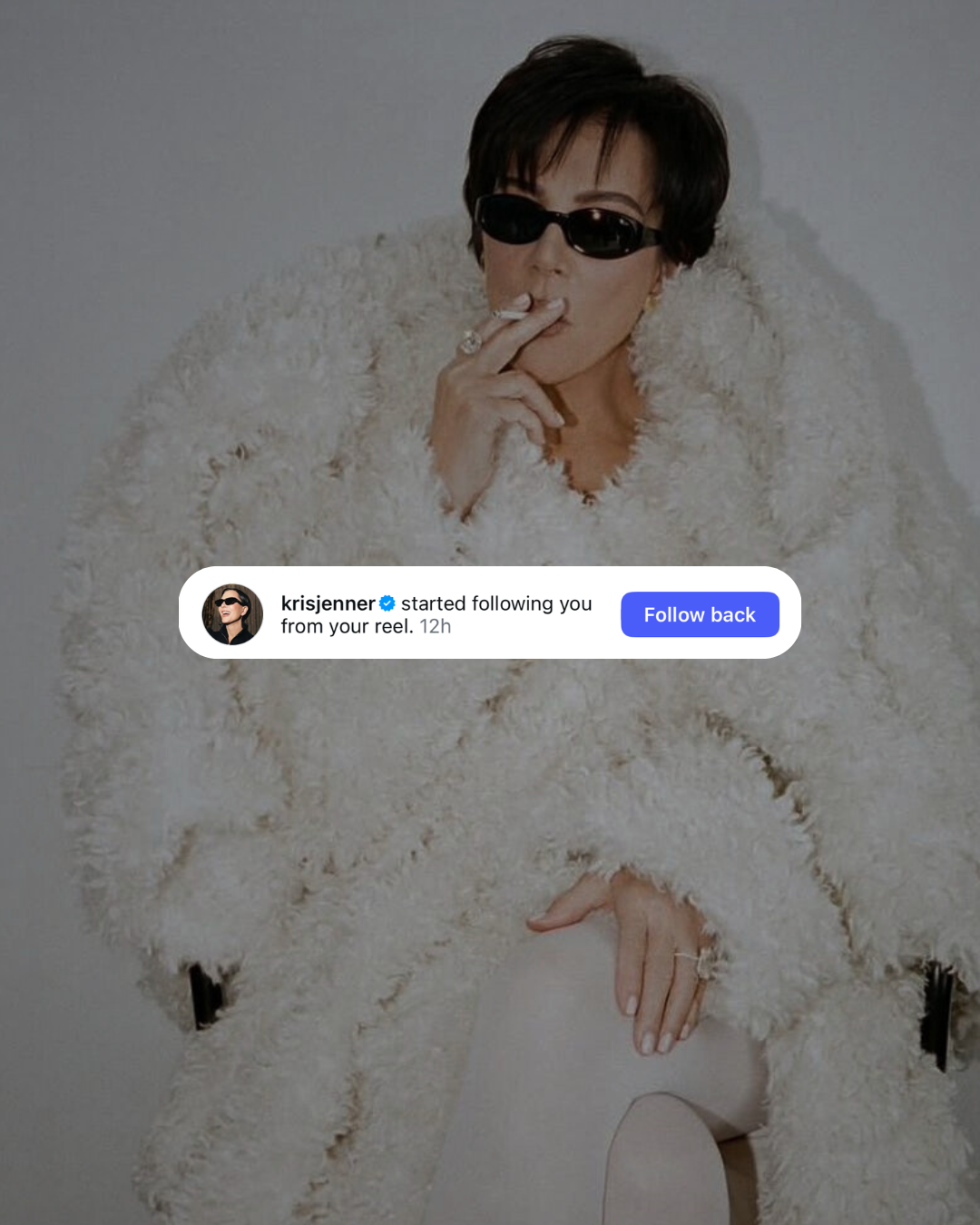 Kris Jenner wearing sunglasses and a fluffy white coat, smoking a cigarette, with a notification overlay showing she started following someone on social media.
